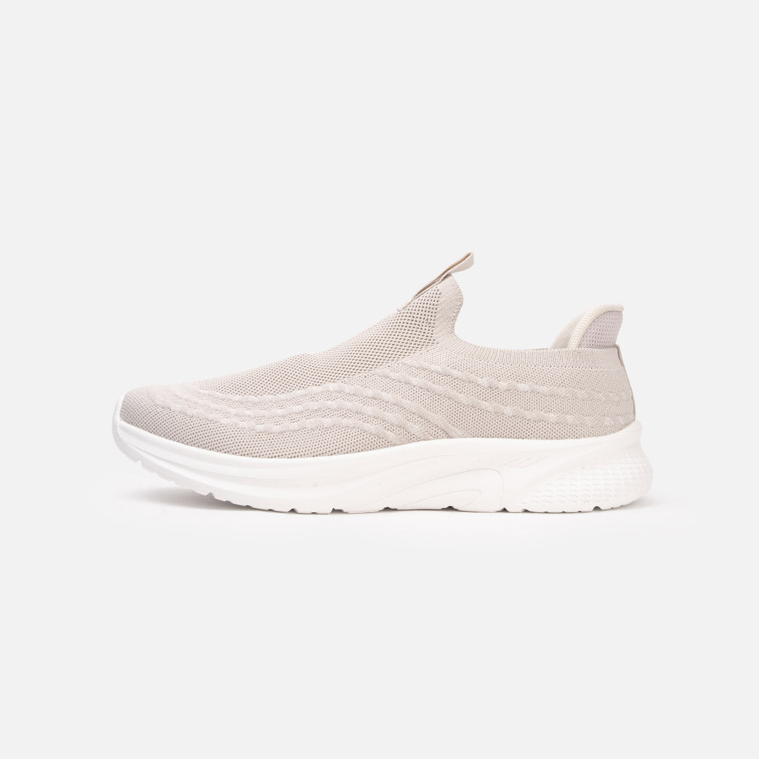 Knit upper with heel and tongue pull tabs, Springfoam midsole system with durable rubber outsole, and Bounce Pad insole system. Provides breathability, flexibility, comfort, moisture control, ventilation, and heel cushioning. Minimal to no break-in time; conforms to any foot shape. Beige and all black. Main image